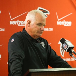 Atlanta head coach Mike Smith faces the media after a humiliating loss Sunday (Photo Credit: Curtis Compton/AJC)